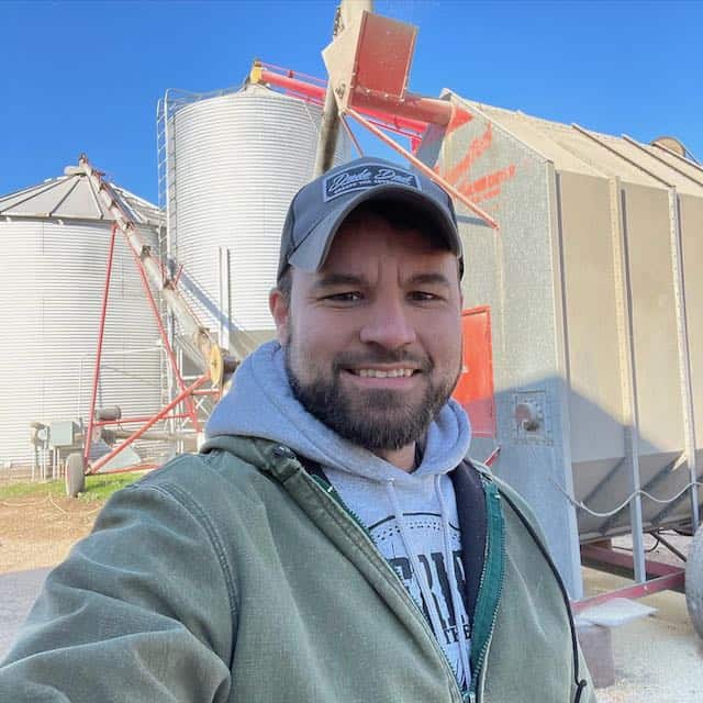 Standing in front of a corn dryer